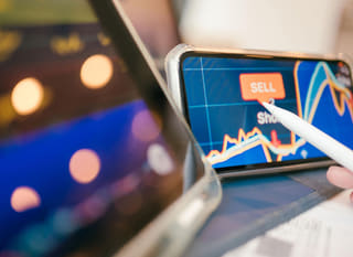 Trader across markets reviewing Bitcoin Ethereum and forex options